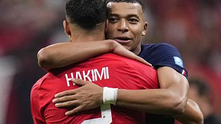 France's Kylian Mbappe hugs Morocco's Achraf Hakimi at the end of the World Cup semi-final in Qatar.