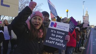 Nurses participate in a protest outside the St. Thomas' Hospital in London, Thursday, Dec. 15, 2022. 