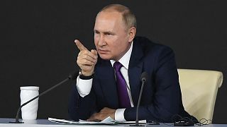 Russian President Vladimir Putin talks at an end-of-year press conference in 2021.