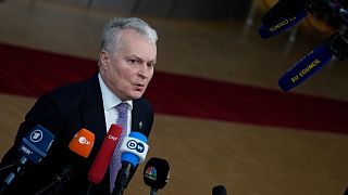 Lithuania's President Gitanas Nauseda speaks with the media as he arrives for an EU summit in Brussels, Dec. 15, 2022.