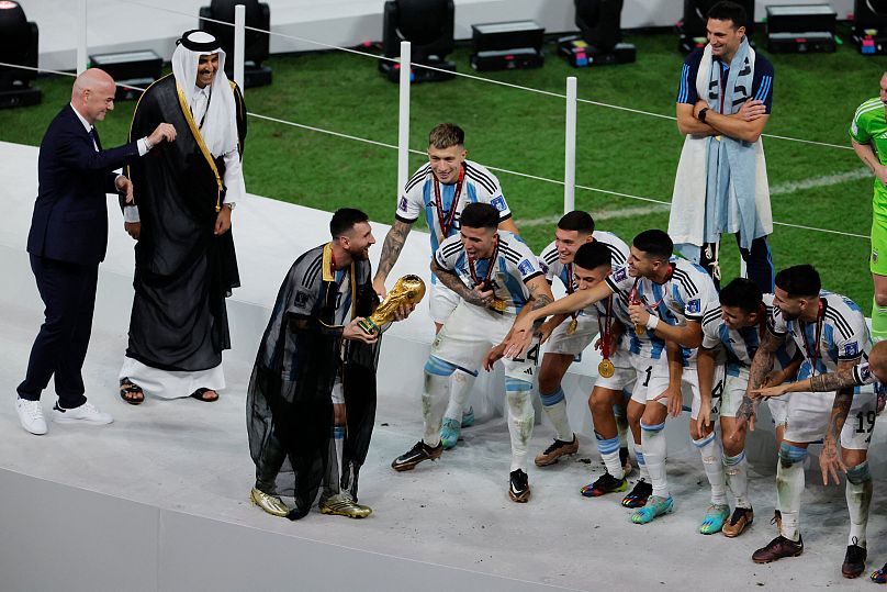 Messi [centre] lifted the trophy in Lusail last December