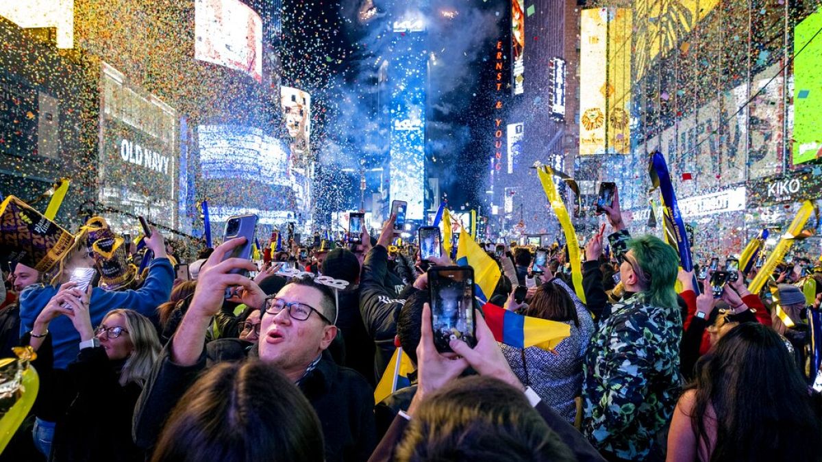 FILE — Revelers celebrate in Times Square in New York, Jan. 1, 2022, as they attend New Year's Eve celebrations. 