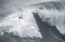 French surfer Eric Rebiere rides a wave during the Tudor Nazare Tow Surfing Challenge at Praia do Norte in Nazare, Portugal. February 10, 2022
