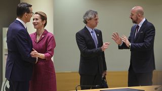 Poland's PM Mateusz Morawiecki, Estonia's PM Kaja Kallas, Slovenia's PM Robert Golob and European Council President Charles Michel at an EU summit in Brussels on Dec 15, 2022.