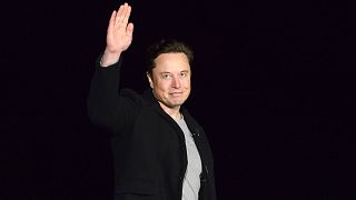 SpaceX's Elon Musk waves while providing an update on Starship, on Feb. 10, 2022, near Brownsville, Texas, USA.