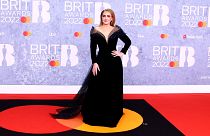 Adele poses for photographers upon arrival at the Brit Awards 2022 in London Tuesday, Feb. 8, 2022.