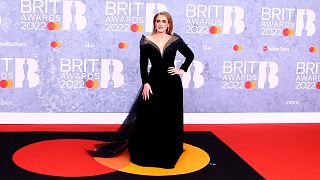 Adele poses for photographers upon arrival at the Brit Awards 2022 in London Tuesday, Feb. 8, 2022.