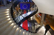 FILE - A man walks down stairs during a special session on lobbying at the European Parliament in Strasbourg, eastern France, Dec. 12, 2022.