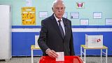 Tunisia's President Kais Saied casts his ballot as he participates in the legislative elections in Tunis, Saturday, Dec. 17, 2022.