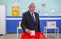Tunisia's President Kais Saied casts his ballot as he participates in the legislative elections in Tunis, Saturday, Dec. 17, 2022.