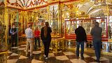 FILE - Visitors stand in the Jewel Room during the reopening of the Green Vault Museum in Dresden's Royal Palace of the Dresden State Art Collections (SKD) in Dresden, Germany