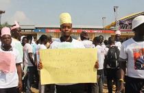 Liberian protester holds sign at demonstration on 17 December 2022