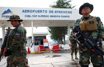Soldiers stand guard outside the airport in Ayacucho, Peru.