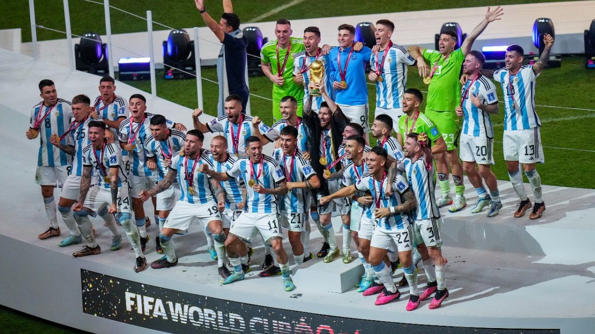 Argentina's squad celebrate after their World Cup final victory against France at the Lusail Stadium in Lusail, Qatar, Sunday, Dec. 18, 2022. 