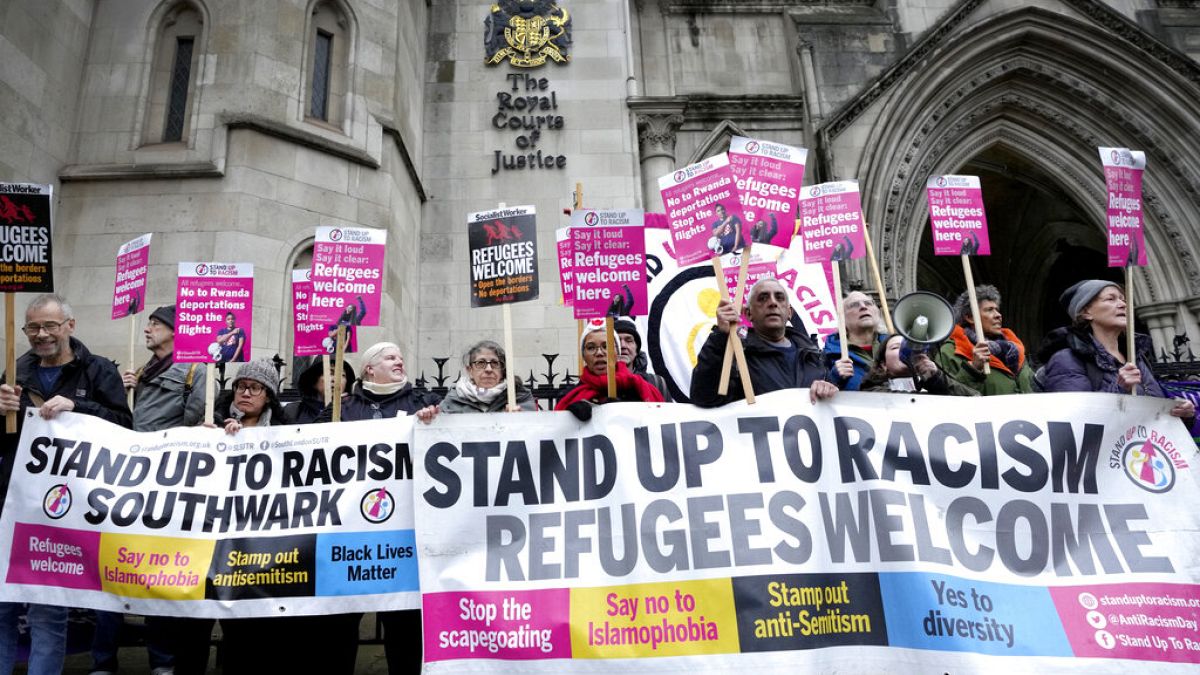 Protesters gathered outside the court in London
