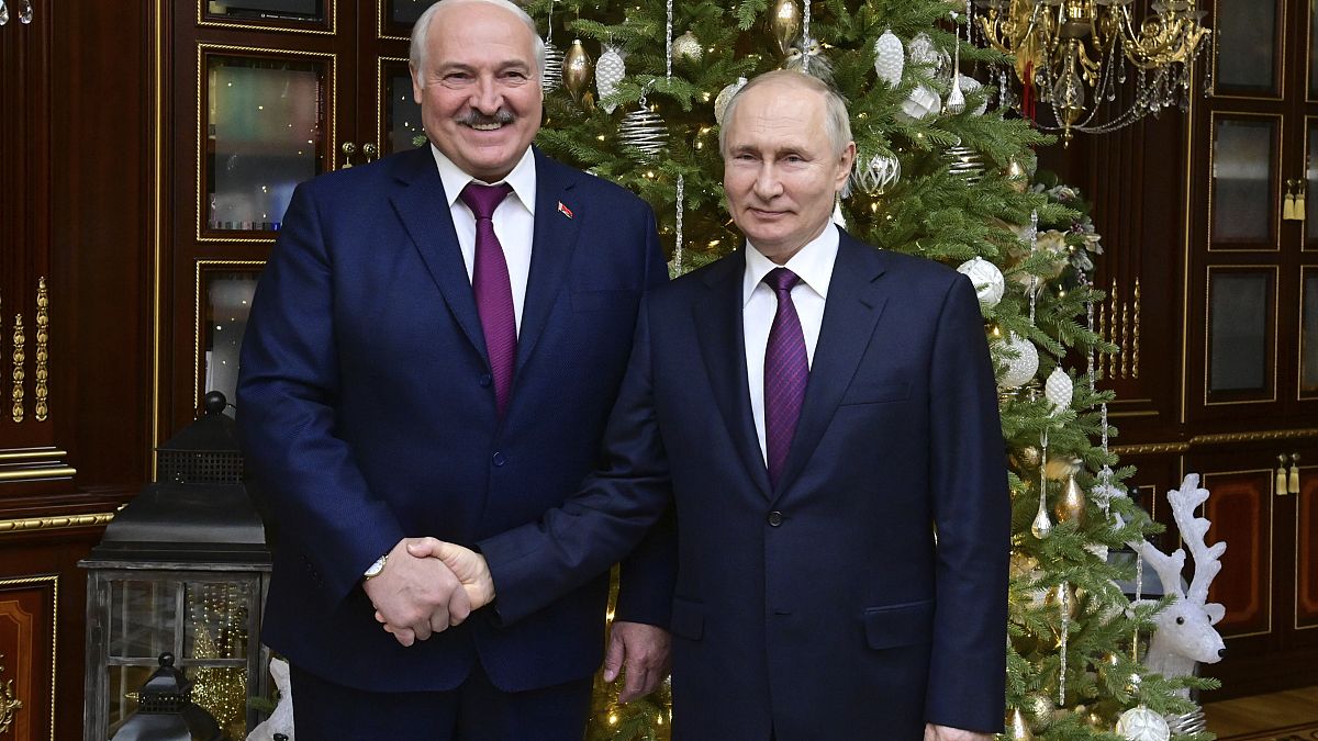 Russian President Vladimir Putin, right, and Belarusian President Alexander Lukashenko pose after their talks in Minsk, Belarus 