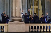 France supporters applaud French players at the balcony of the Hotel Crillon, Monday, Dec. 19, 2022 in Paris. 