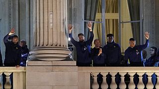 France supporters applaud French players at the balcony of the Hotel Crillon, Monday, Dec. 19, 2022 in Paris. 