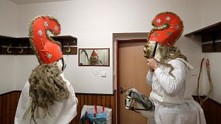 Revelers prepare for a traditional St Nicholas procession in the village of Valasska Polanka, Czech Republic, Saturday, Dec. 7, 2019