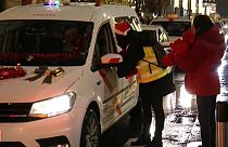 Taxi drivers take the elderly for a drive through Madrid to show them the lights