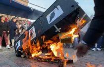 Protesters burn cardboard coffin depicting pictures of politicians and rats in Cusco, Peru.