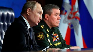 Russian President Vladimir Putin, left, and Chief of the General Staff General Valery Gerasimov attend a meeting in Moscow, Russia, 21 December 2022