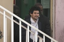 FTX founder Sam Bankman-Fried, is escorted from the Magistrate Court in Nassau, Bahamas, Wednesday, Dec. 21, 2022