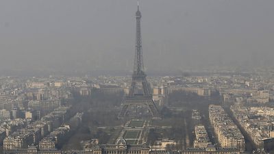 The Eiffel Tower, is photographed through the smog in Paris on March 14, 2014.
