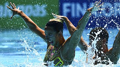ARCHIVO - Giorgio Minisi y Lucrezia Ruggiero compiten durante la final técnica de dúo mixto de natación artística en los XIX Campeonatos del Mundo de la FINA, 20/06/2022
