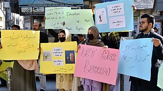A group of Afghan students rally in Quetta, Pakistan on Saturday to protest against The Taliban's decision to ban women from universities in Afghanistan.