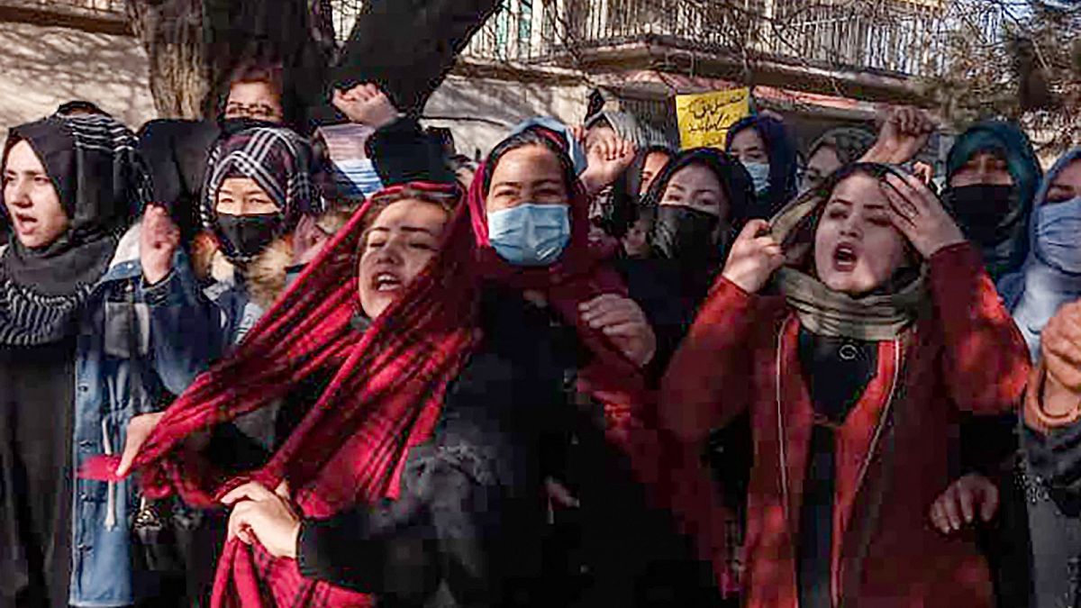 Afghan women chant slogans to protest against the ban on university education for women, in Kabul on December 22, 2022.