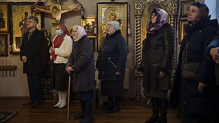 Ukrainians attend a Christmas mass at an Orthodox Church in Bobrytsia, outskirts of Kyiv, Ukraine, Sunday, Dec. 25, 2022.