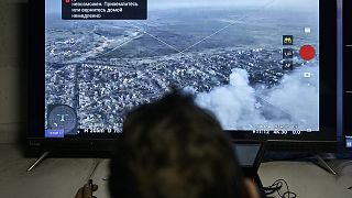 A Ukrainian soldier watches a drone feed from an underground command center in Bakhmut, 25 December 2022