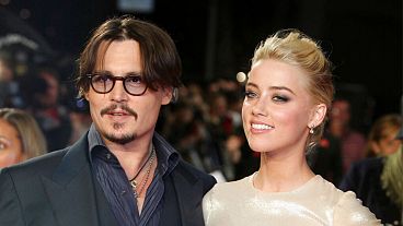 ctors Johnny Depp, left, and Amber Heard arrive for the European premiere of their film, "The Rum Diary," in London 2011.