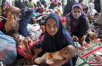 لاجئون من أقلية الروهينغا  يجلسون في مأوى مؤقت في شمال آتشيه بإندونيسيا، نوفمبر 2022.