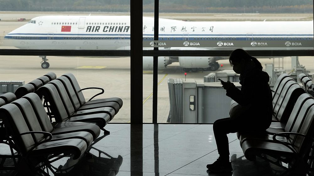 China to open up to international travel in January as COVID-19 cases soar