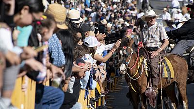 Costa Rica jockeys participate in traditional 'El Tope' parade.