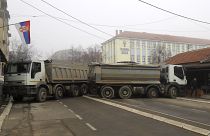 Trucks are being used as makeshift barricades in the northern Kosovo town of Mitrovica.