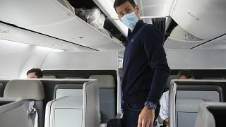 Novak Djokovics 2022. januárjában egy repülőgépen