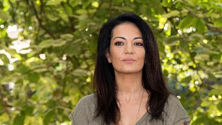 Moroccan director Maryam Touzani poses during a photocall for the film 'Le bleu du Caftan'.