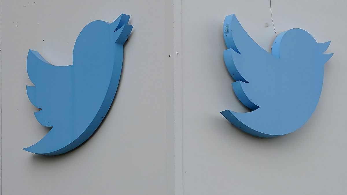 Twitter logos hang outside the company's offices in San Francisco, Monday, Dec. 19, 2022.