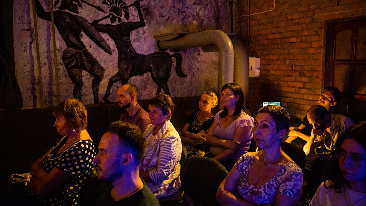 Spectators watch a performance at the underground of the Mykolaiv Drama Theatre for the first time since the start of the war.