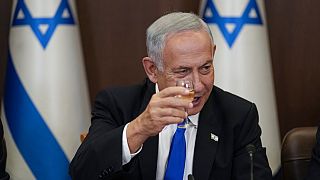 Newly sworn in Israeli Prime Minister Benjamin Netanyahu makes a toast during a cabinet meeting in Jerusalem Thursday, Dec. 29, 2022.