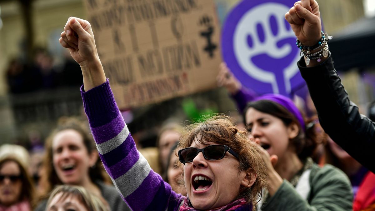 Women shout slogans during International Women's Day in Pamplona, northern Spain, Sunday, March 8, 2020.