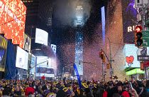 Times Square lights up for the 2023 ball drop in New York. 
