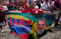A supporter of Luiz Inacio Lula da Silva displays a banner during his inauguration as new president in Brasilia, 1 January 2023