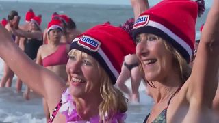 Thousands of people plunged into the icy cold North Sea as part of a New Year's Day tradition in the Dutch seaside town of Scheveningen