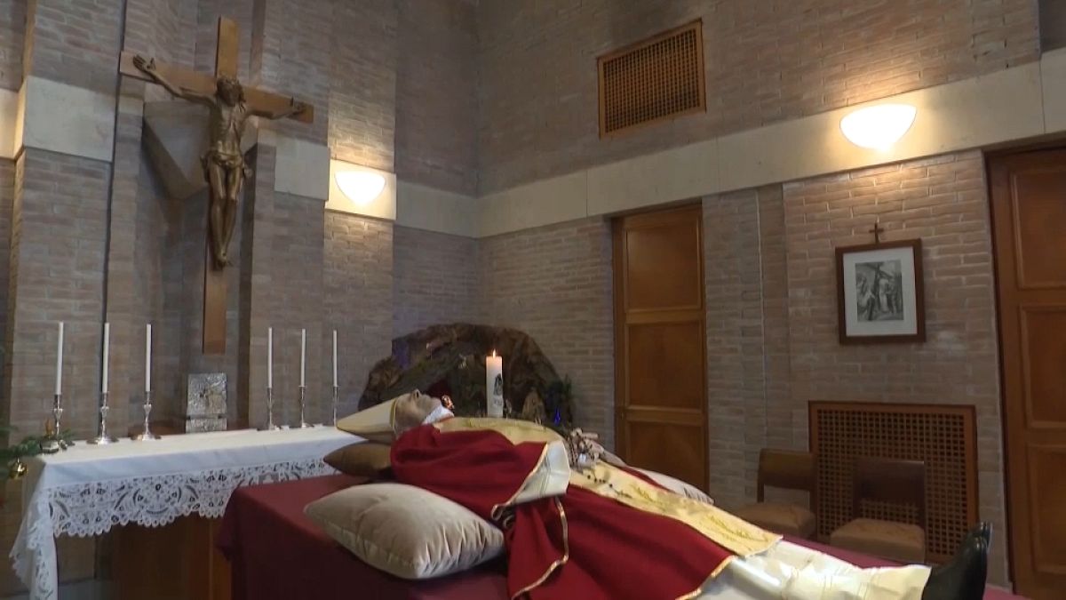 Pope Emeritus Benedict XVI lying in state at a Vatican chapel.