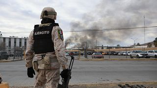 A Mexican soldiers stands guard outside a state prison in Ciudad Juarez, Mexico, Sunday Jan 1, 2023.