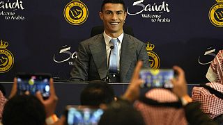 Cristiano Ronaldo smiles during a press conference for his official unveiling as a new member of Al Nassr soccer club in in Riyadh, Saudi Arabia, Tuesday, Jan. 3, 2023.